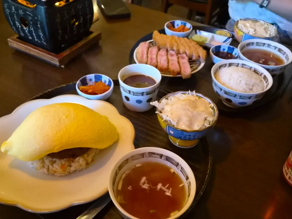 Table setting of sirloin gyukatsu and hamburger steak omurice at Gyuen-dang Avenue France Gwanggyo