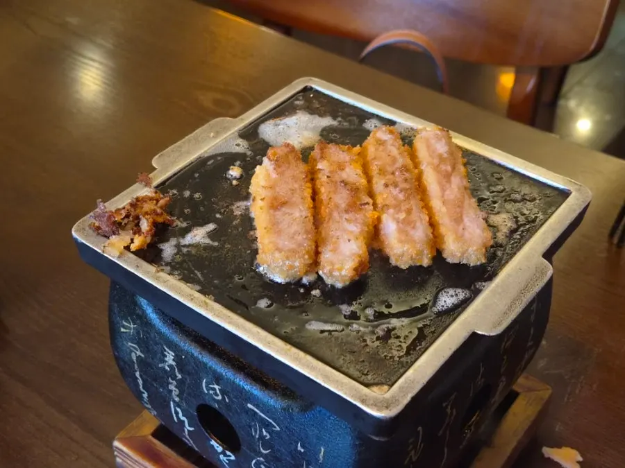 A piece of sirloin gyukatsu with salt and wasabi