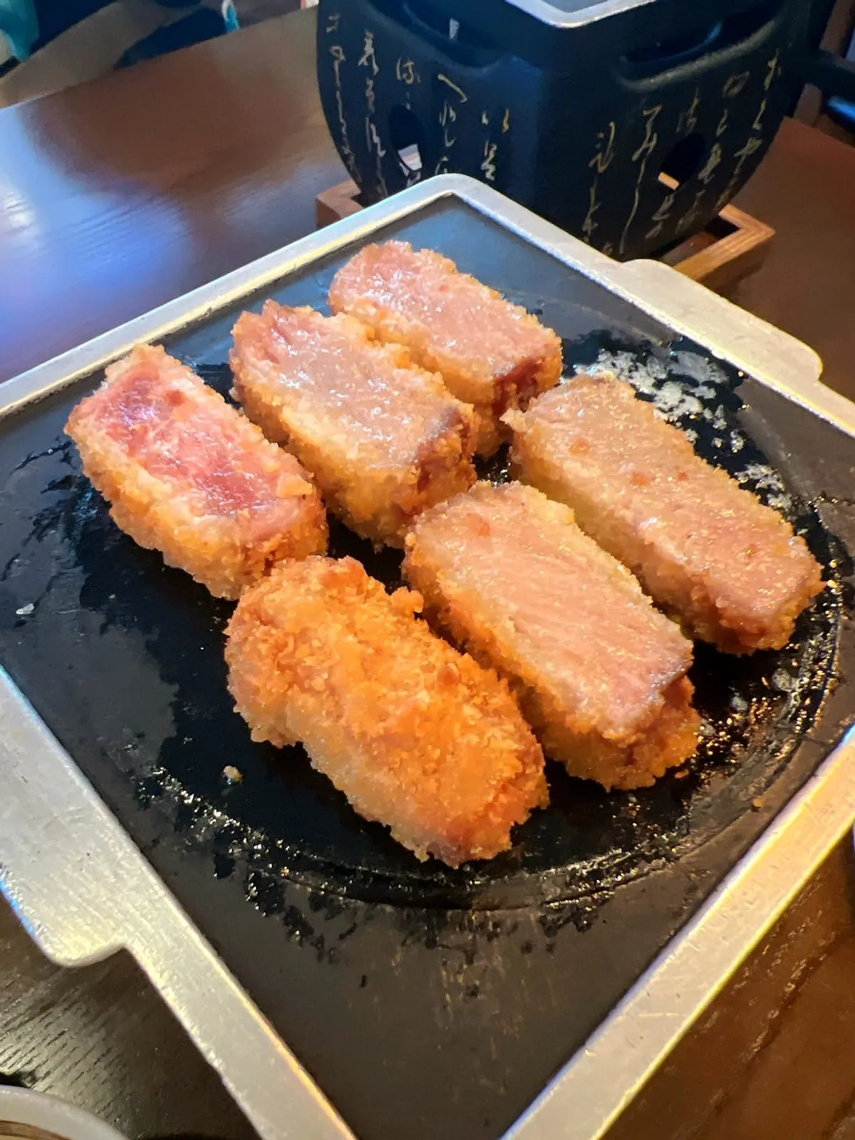 Close-up of gyukatsu grilling on the mini grill