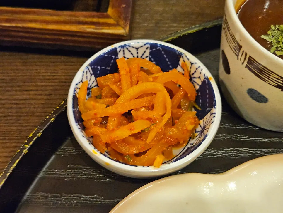 Butter, sauce, wasabi, and salt served with the gyukatsu