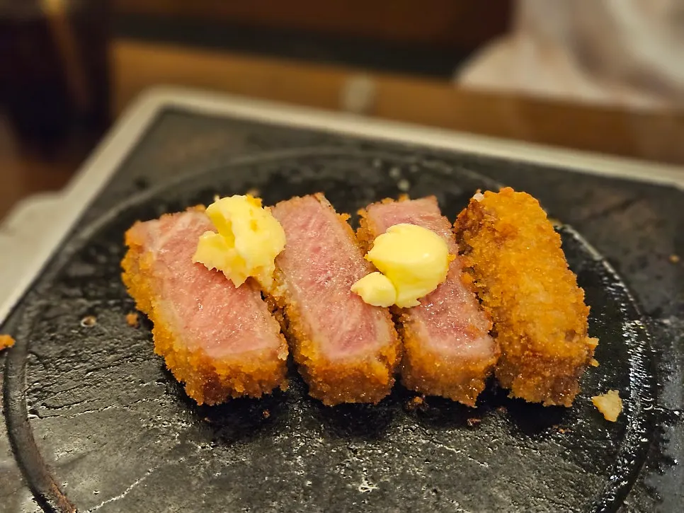 Piece of gyukatsu grilled and topped with wasabi