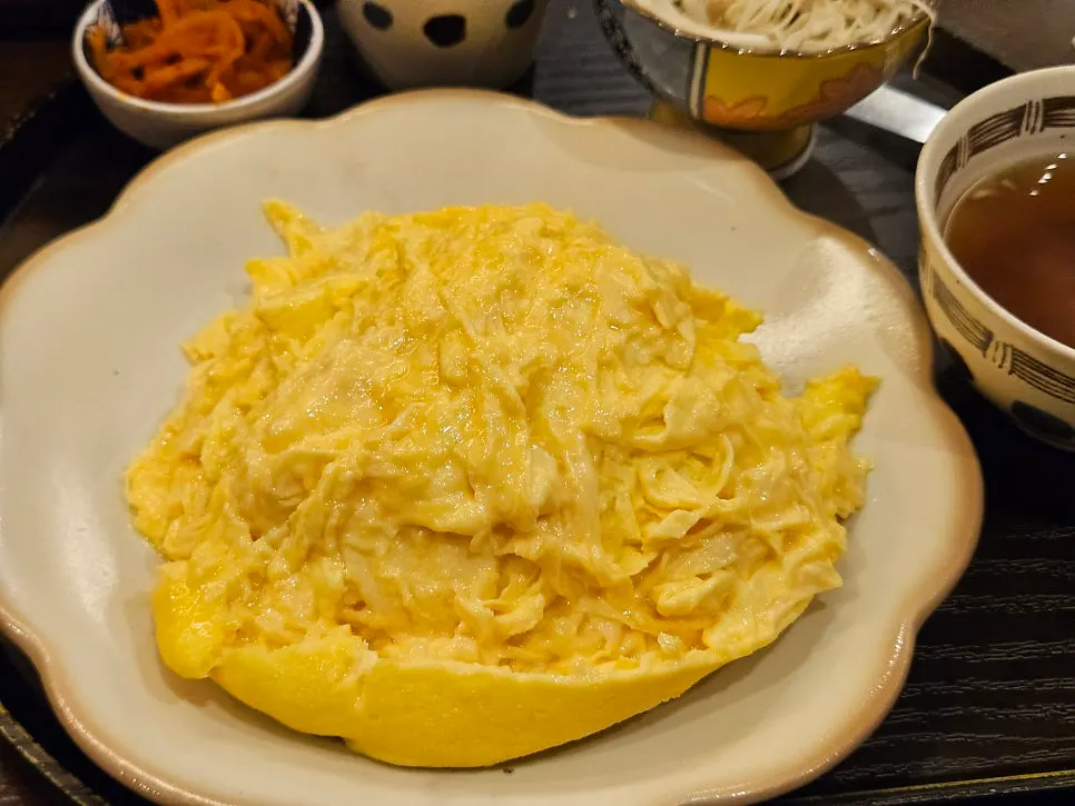 Omurice egg split down the center and spread wide