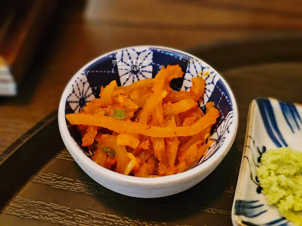 Plate of fresh wasabi and salt served alongside