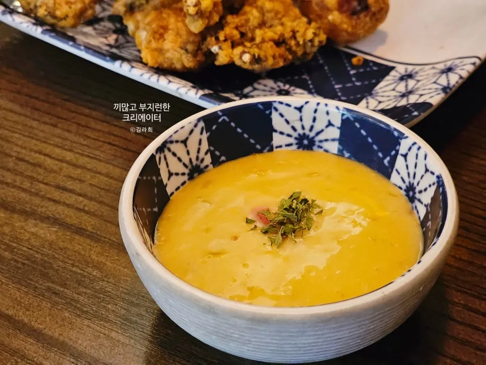 Dipping the geso-age tempura in sauce