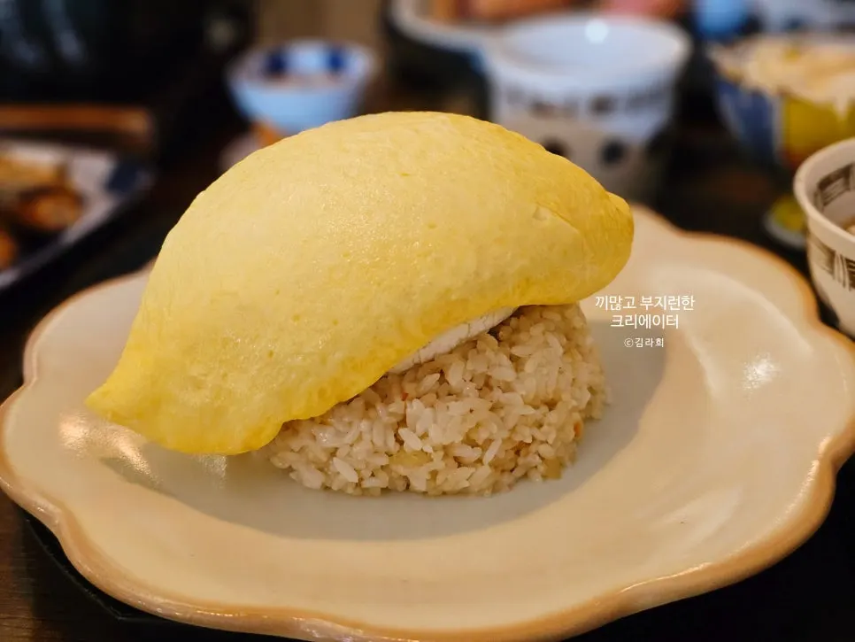 Gyuen-dang omurice topped with a whole brie cheese