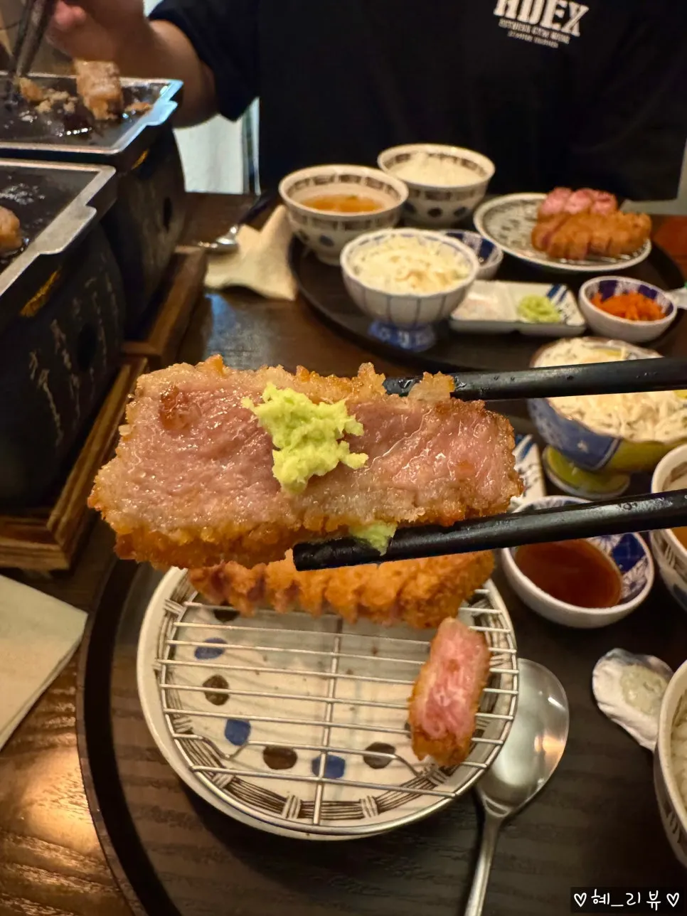 A piece of gyukatsu topped with wasabi