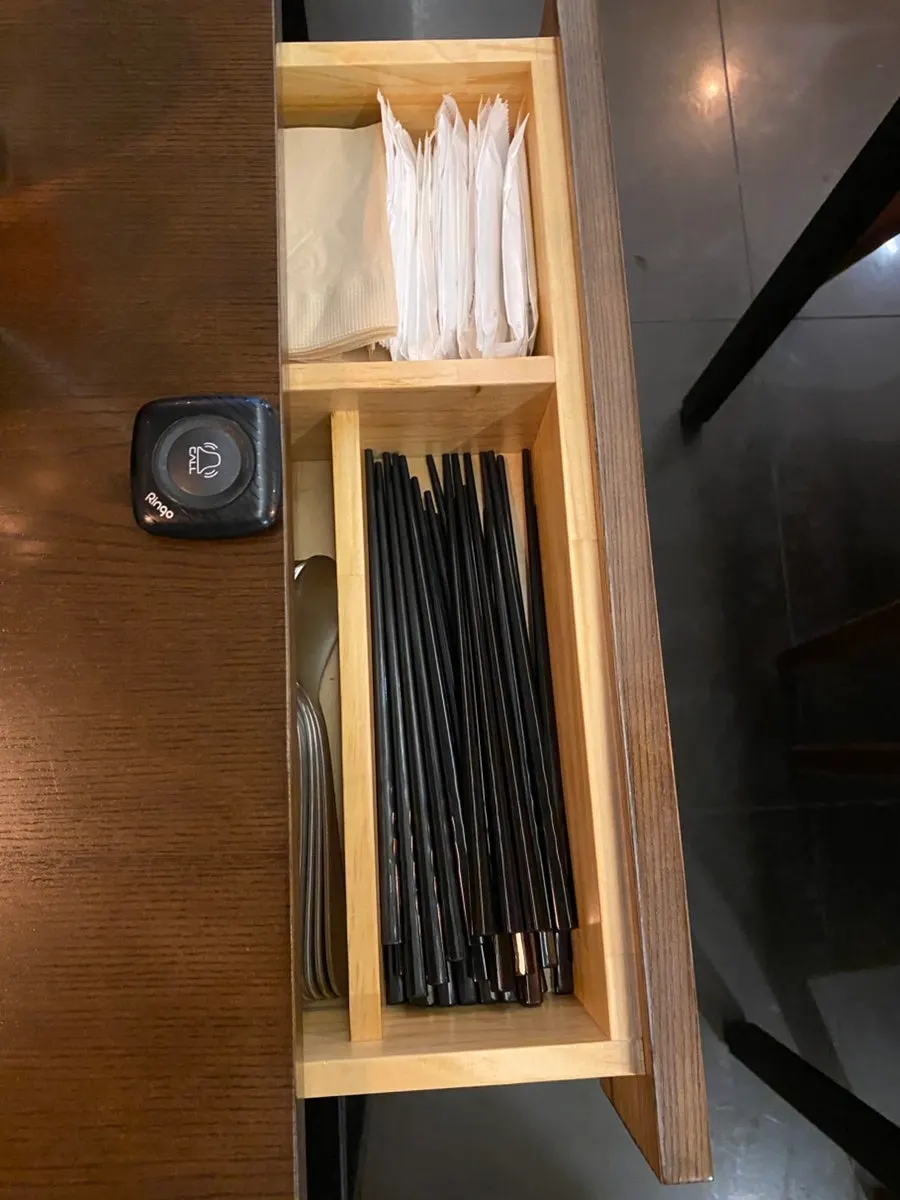 Table drawer holding utensils
