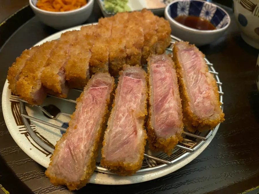 Plate of sirloin gyukatsu with a reddish cut surface