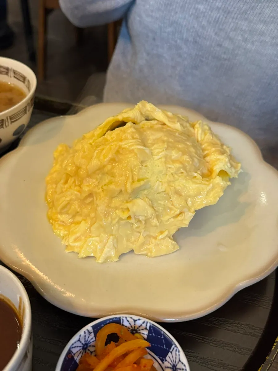 Hamburg steak revealed inside the halved omurice egg