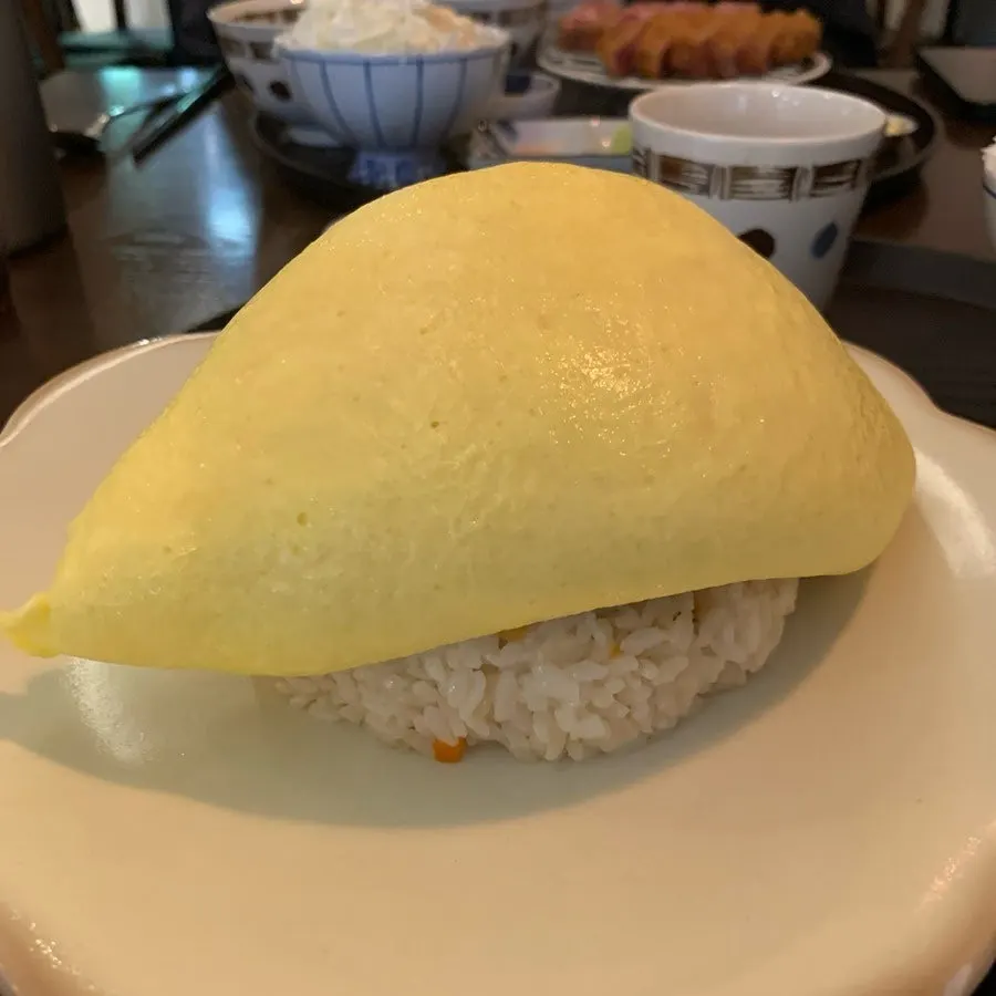 A full spread of gyukatsu and omurice at Gyuen-dang
