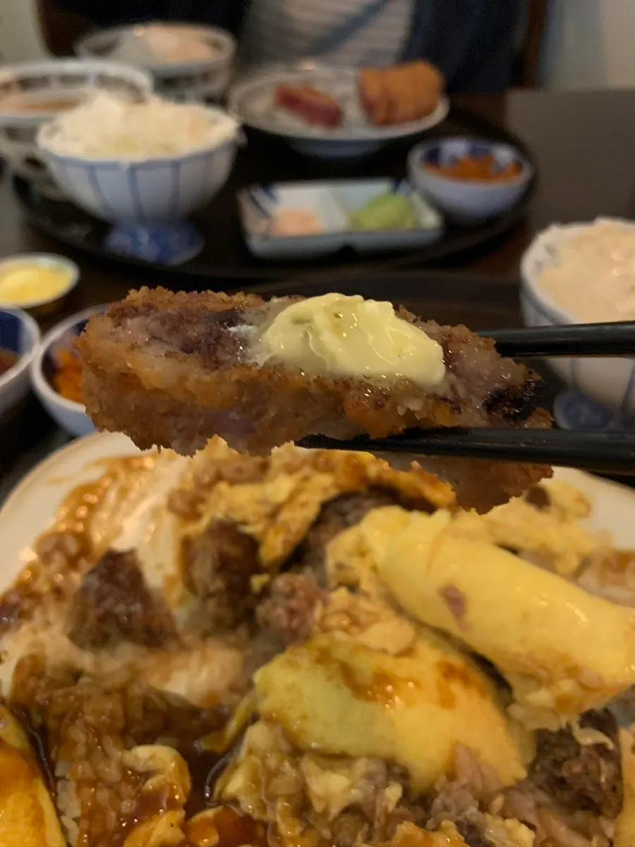 A piece of sirloin gyukatsu eaten with butter on top