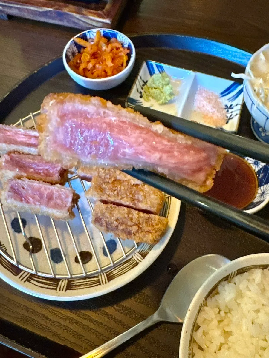 Mini charcoal grill lit at the table