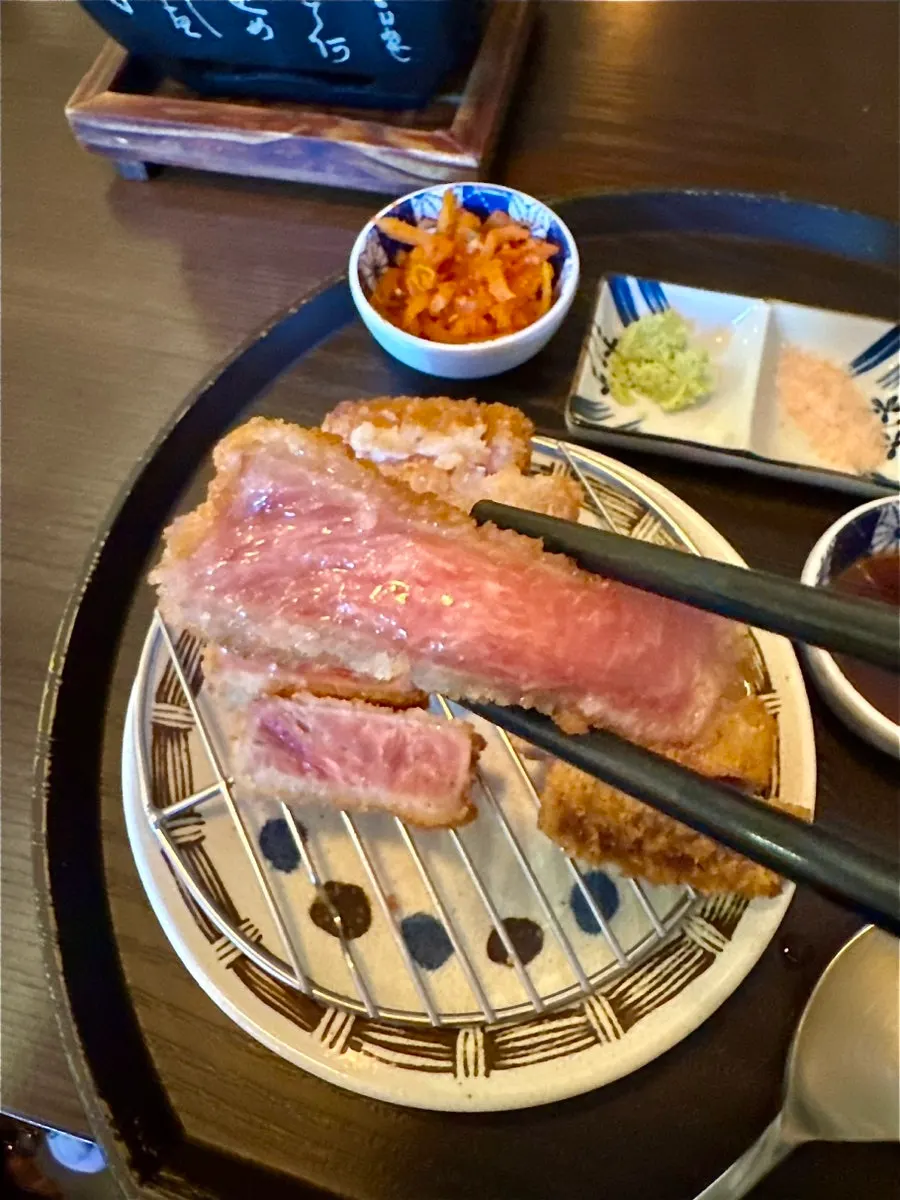 Gyukatsu sizzling as it grills with butter