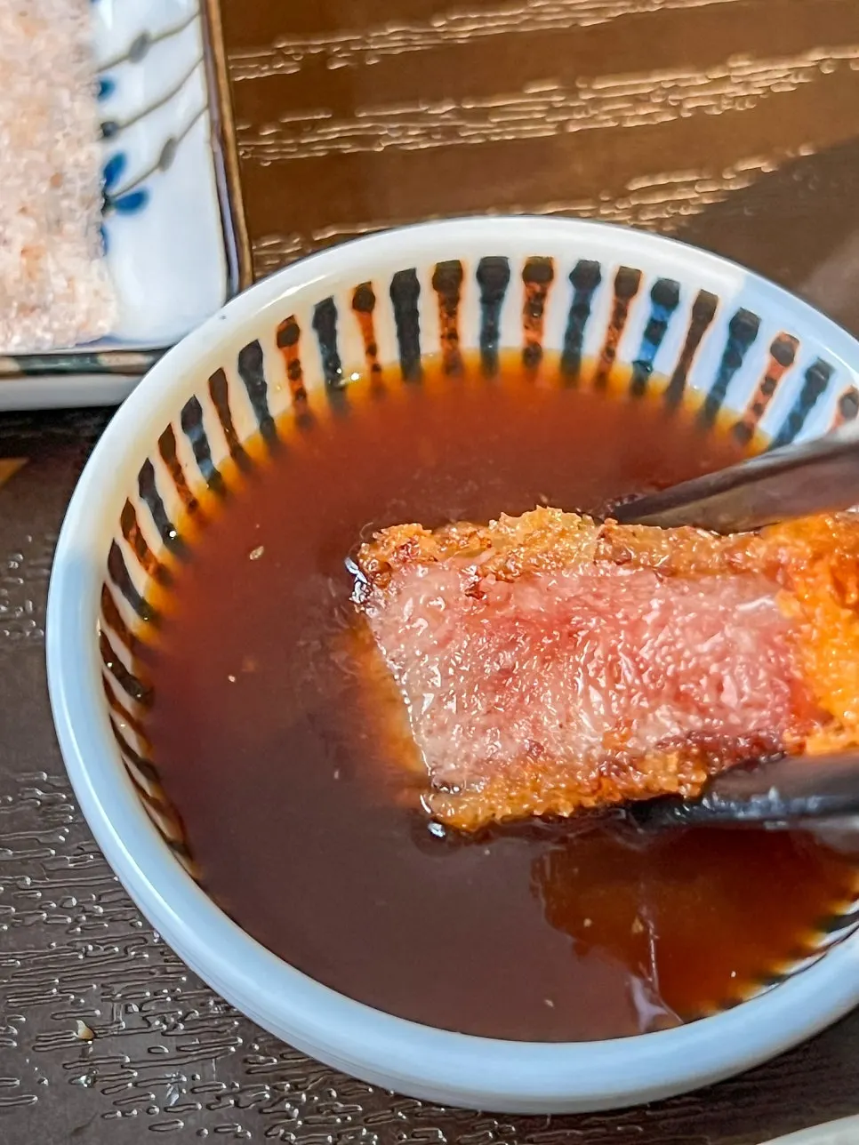 Tenderloin gyukatsu being grilled with butter