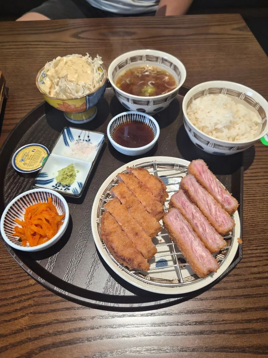Sirloin gyukatsu table setting with cabbage salad and miso soup