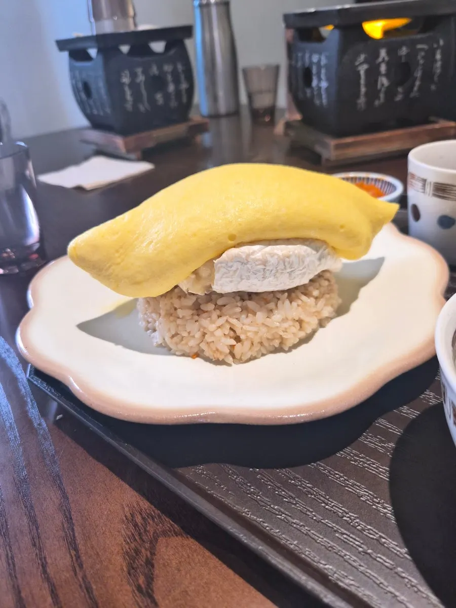 Omurice with a whole brie cheese inside
