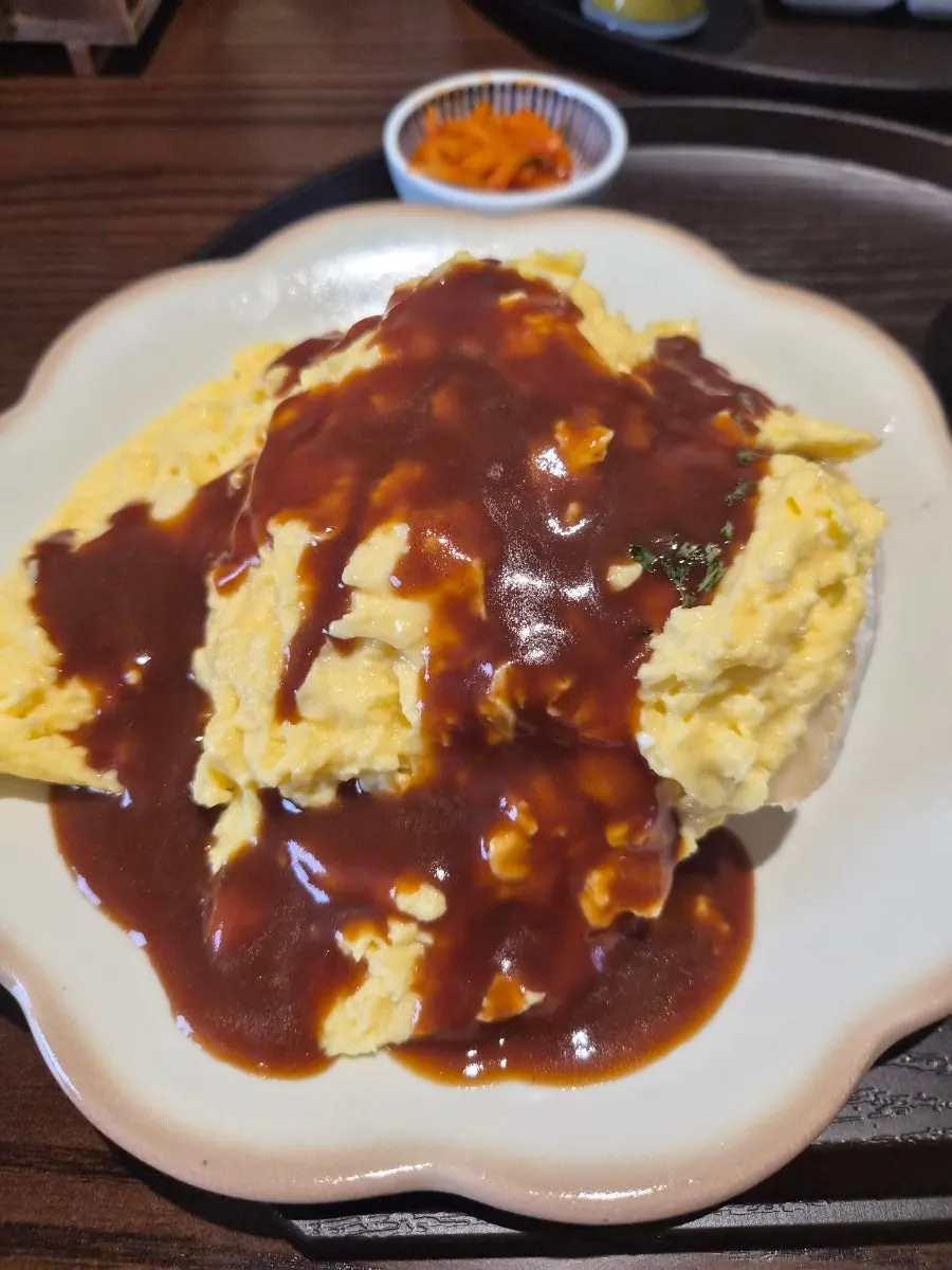 A spoonful with melted brie cheese and rice together