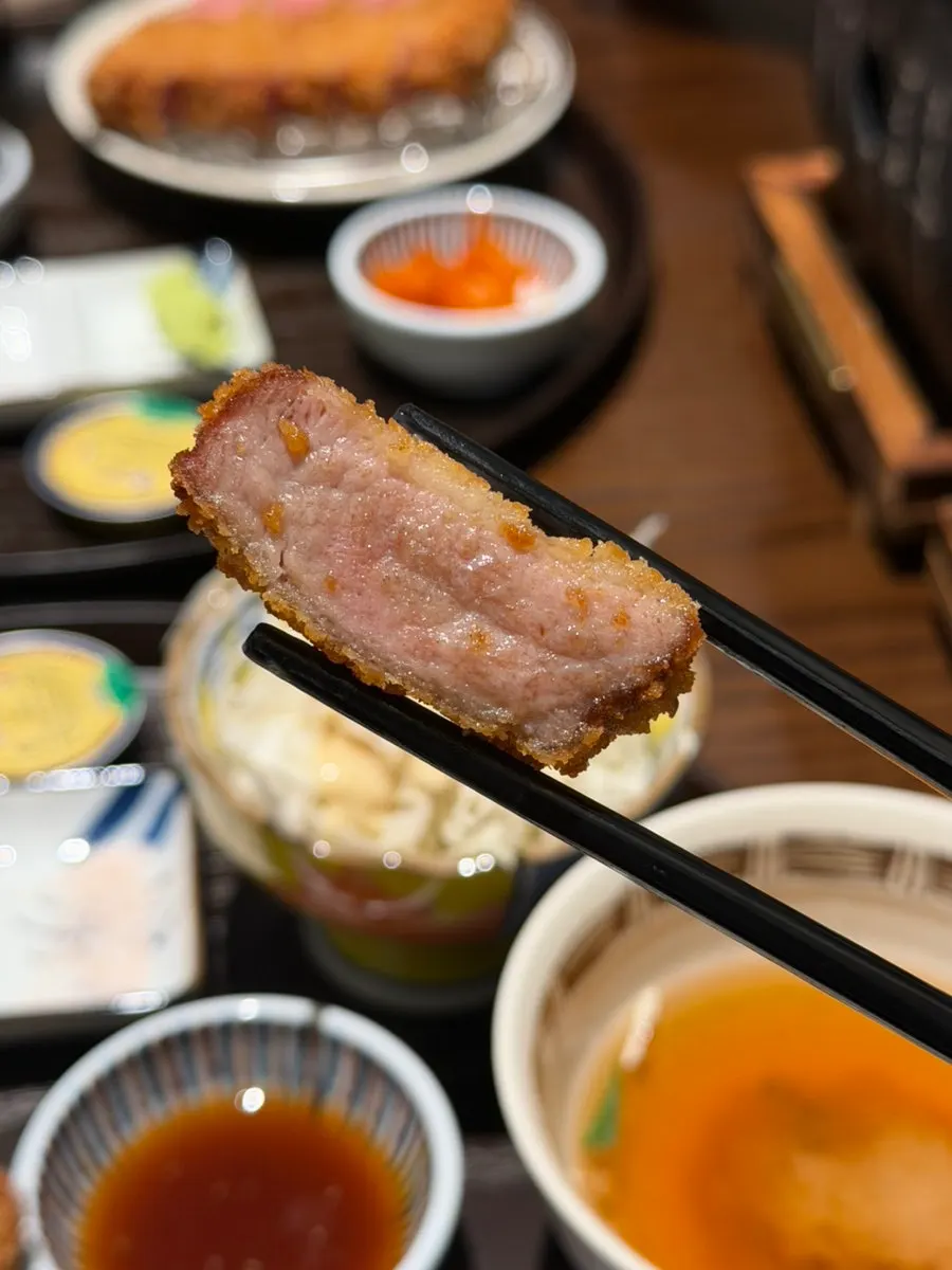 Two pieces of gyukatsu cooked to different levels