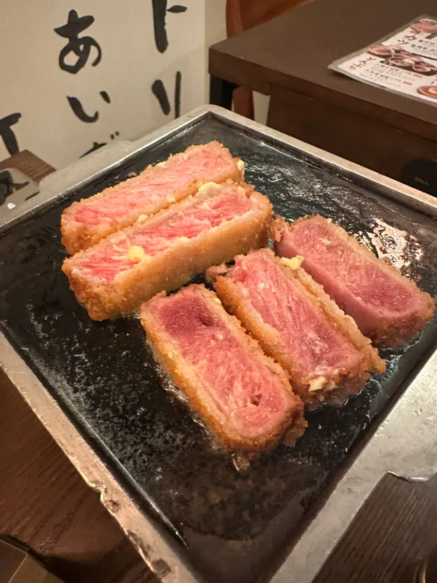 Two table settings with tenderloin and striploin gyukatsu