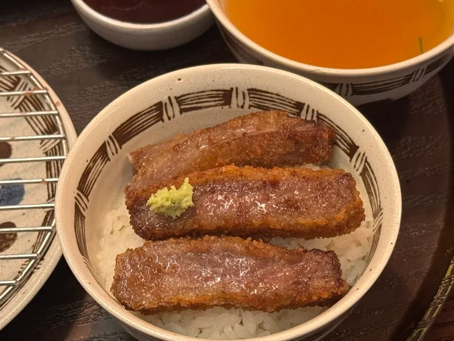 Beef katsu sizzling on the tabletop grill