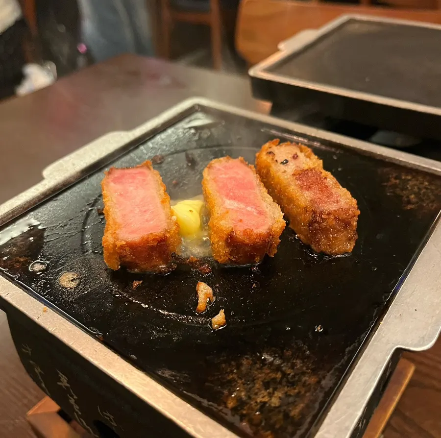 Gyukatsu absorbing butter as it grills