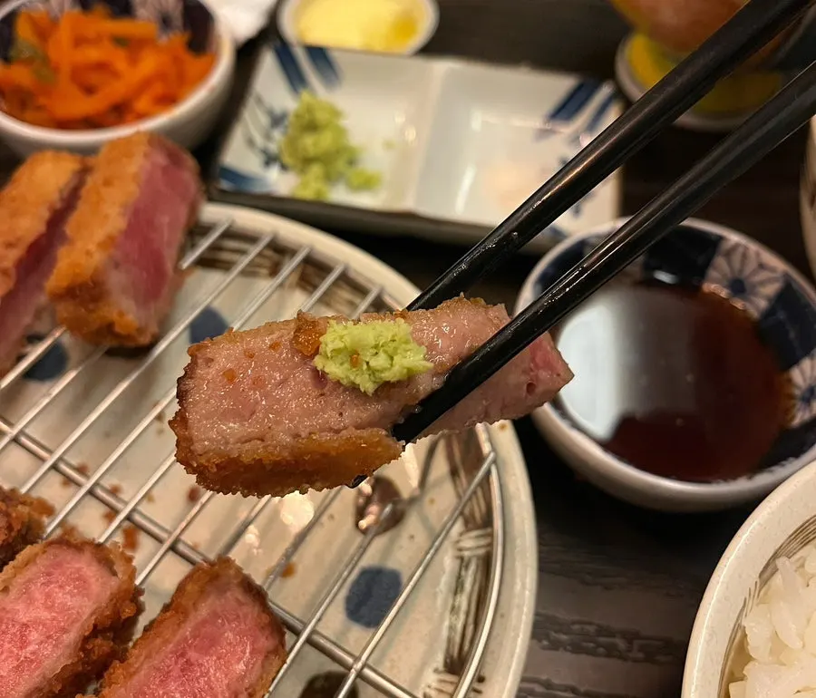 Wasabi, salt, and ginger sauce served alongside the meal