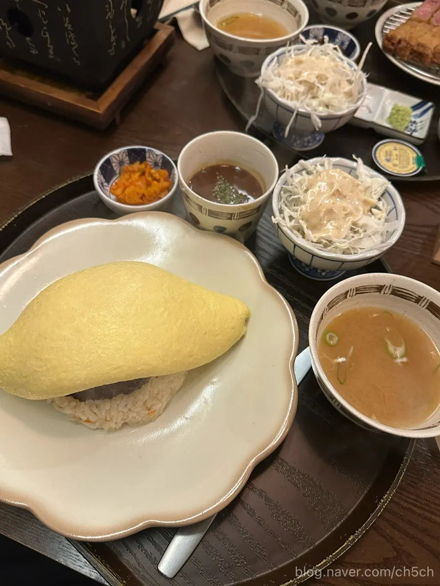 Hamburg omurice cut open with a knife
