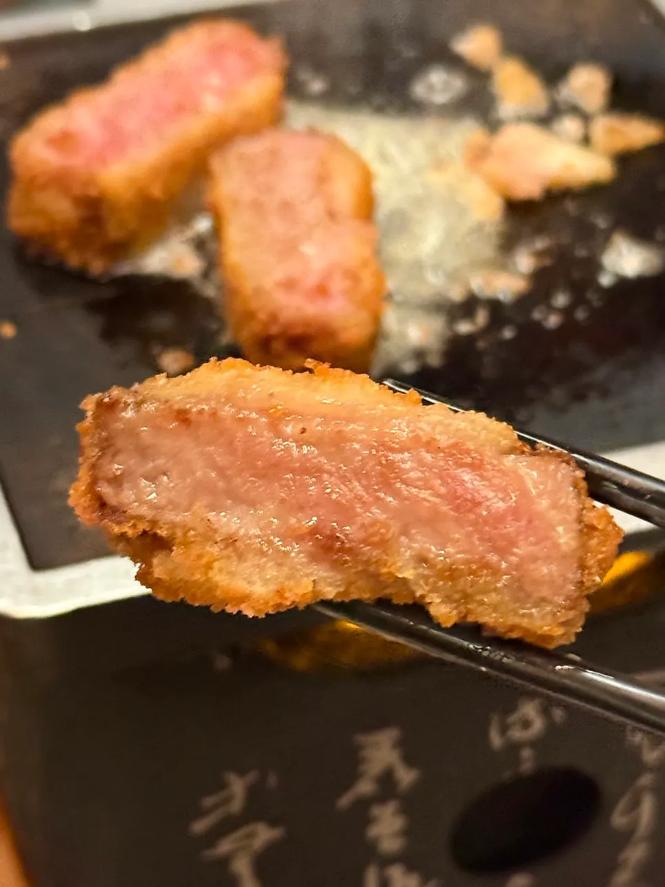 Cross-section of lightly grilled, moist tenderloin gyukatsu