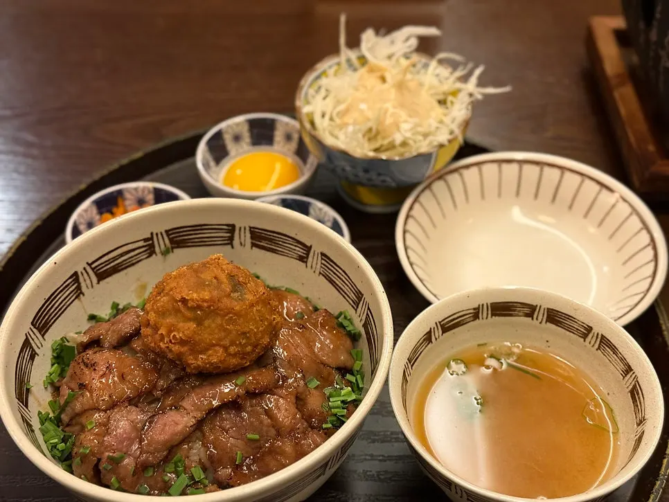 A piece of gyukatsu topped with wasabi