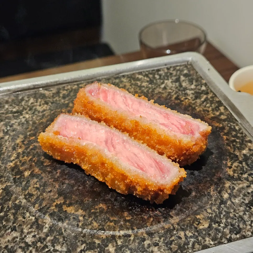 Bright red sirloin meat inside the crispy breading