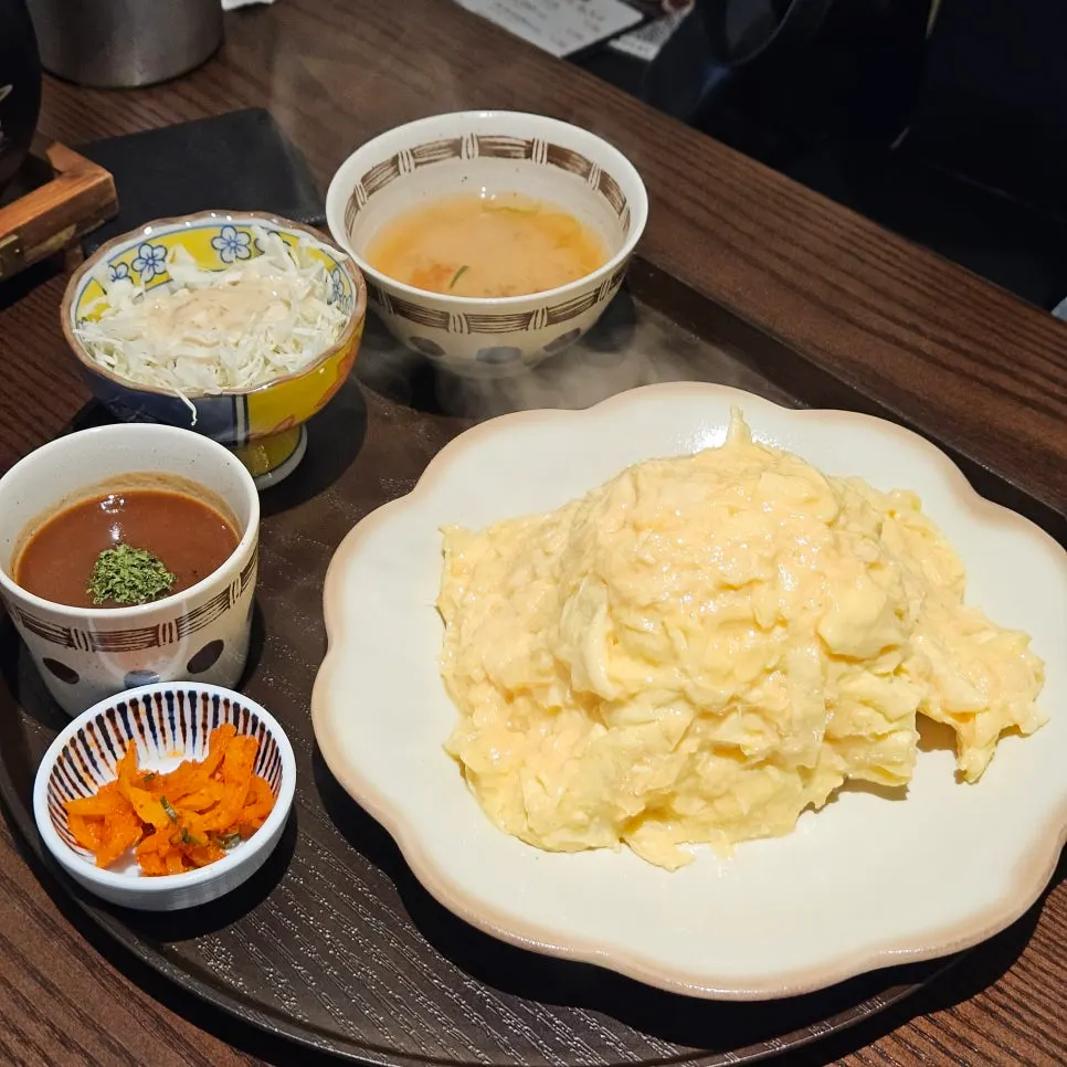 A large chunk of brie cheese sitting on top of the omurice