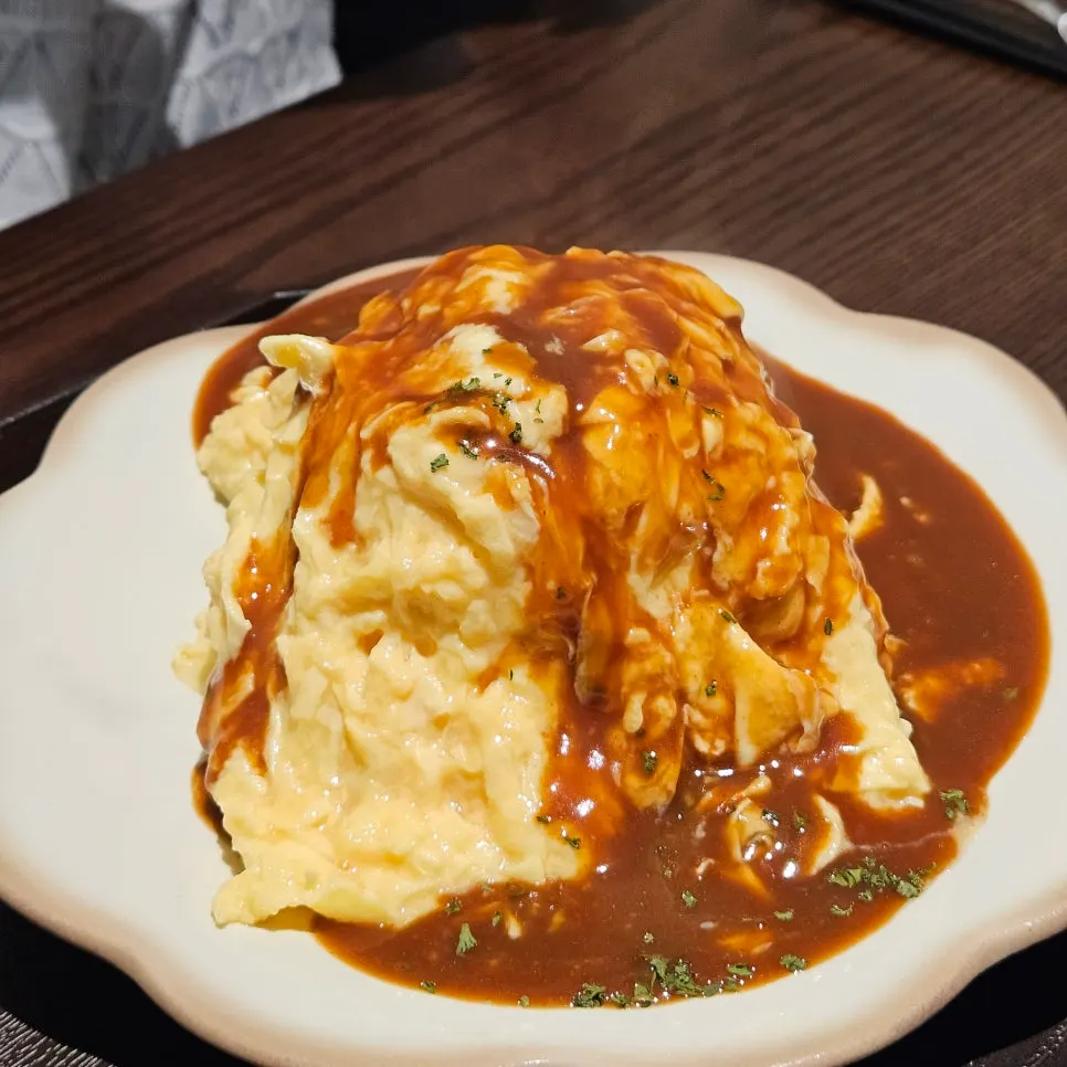 Brie cheese omurice topped with demi-glace sauce
