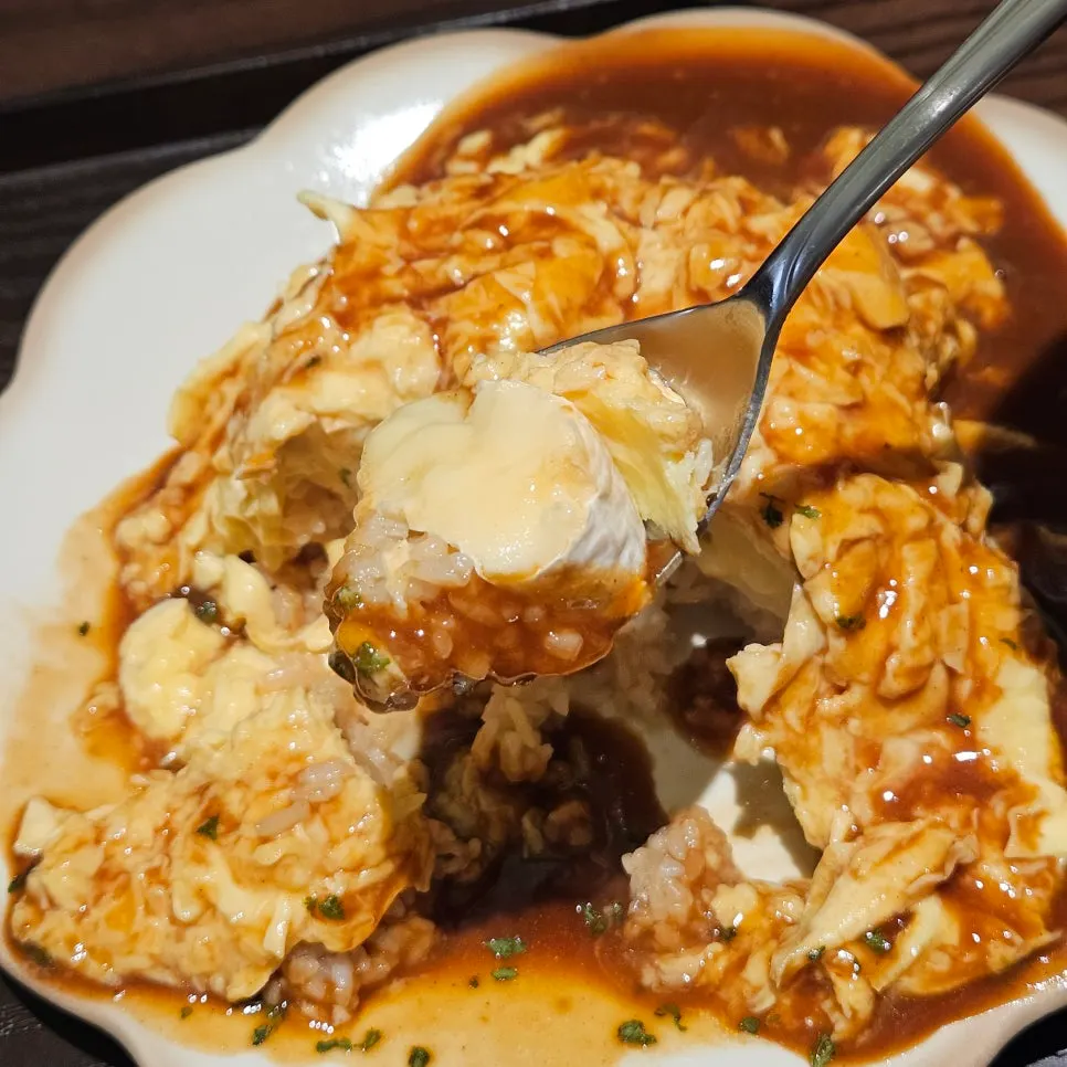 A generous spoonful of brie cheese omurice