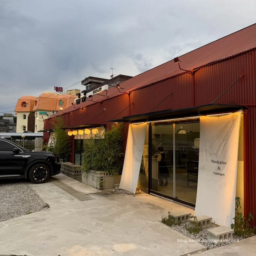 Large parking lot behind the Gyugyu Donkatsu building