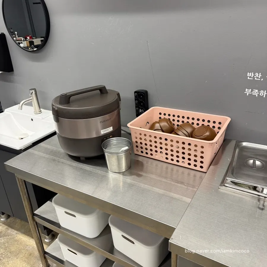 Self-serve refill bar with side dishes and salad