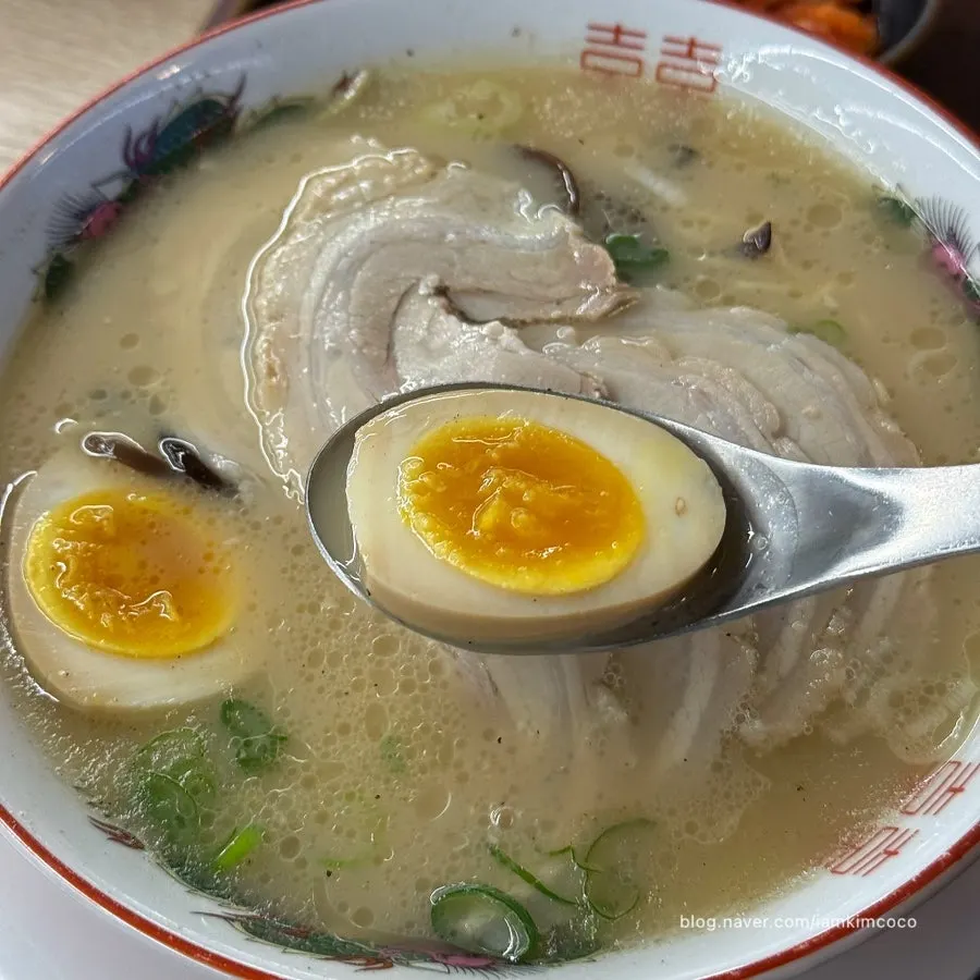 Rich broth and soft-boiled egg in the chashu ramen