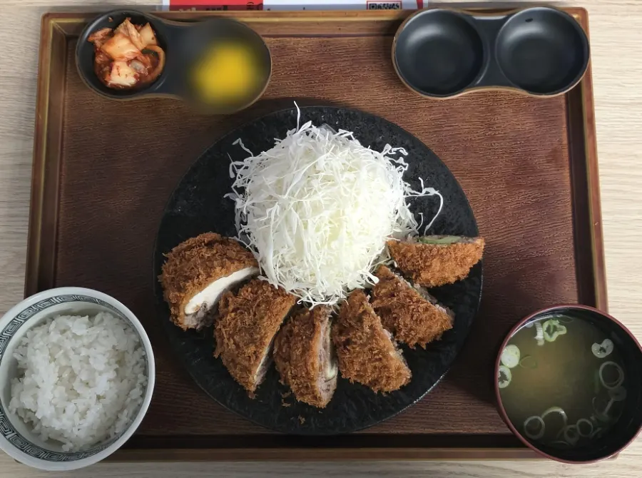 Table set with the chashu ramen set and menchi katsu