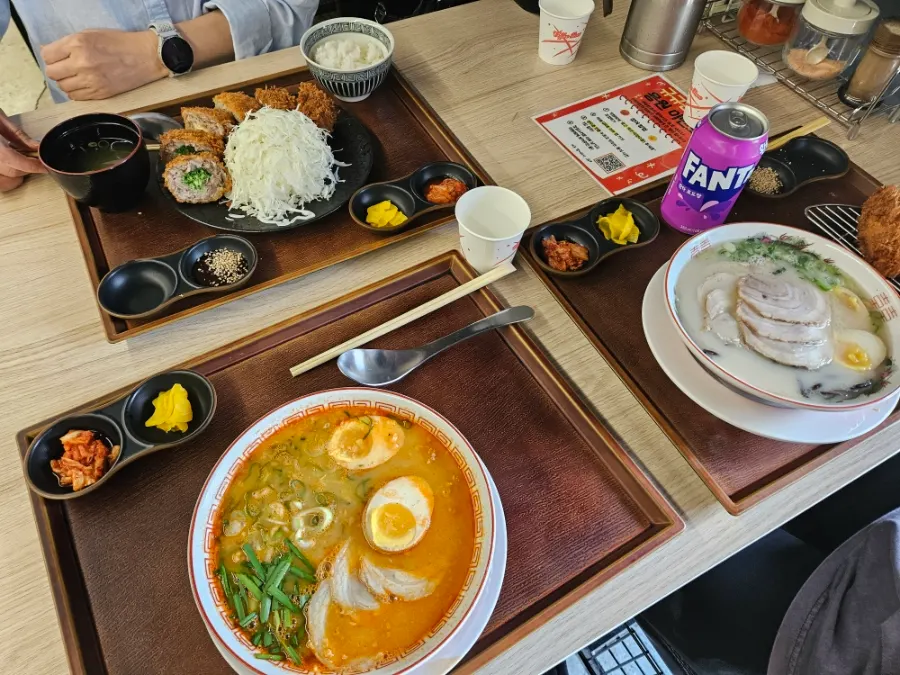 Table spread of the lunch set, menchi katsu, and Taiwan ramen