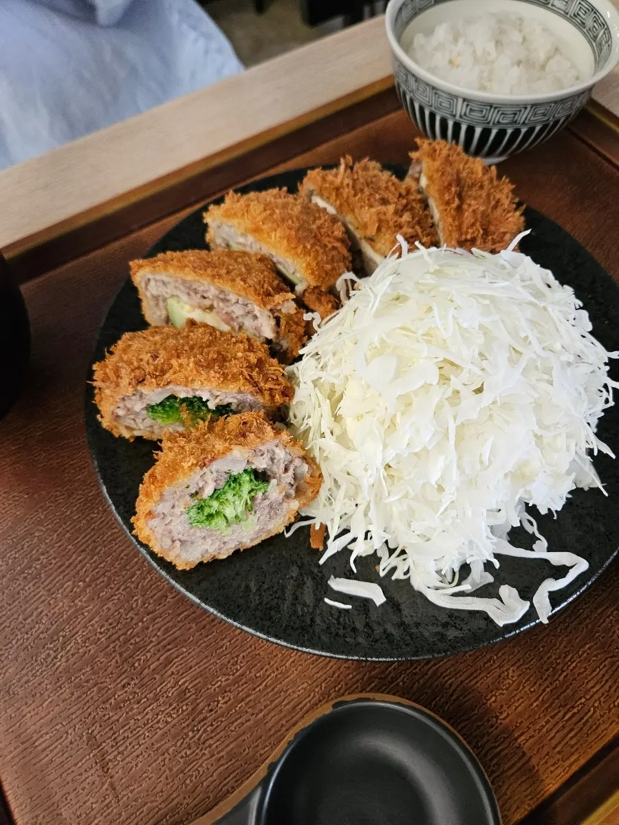Cross-section of the menchi katsu showing its crispy coating