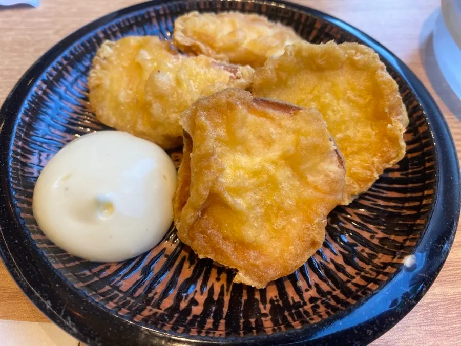 Sweet potato fritters served before the meal with mayonnaise sauce