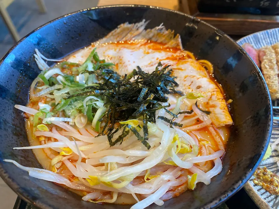 Spicy tonkotsu ramen topped with big chunks of Korean pork chashu