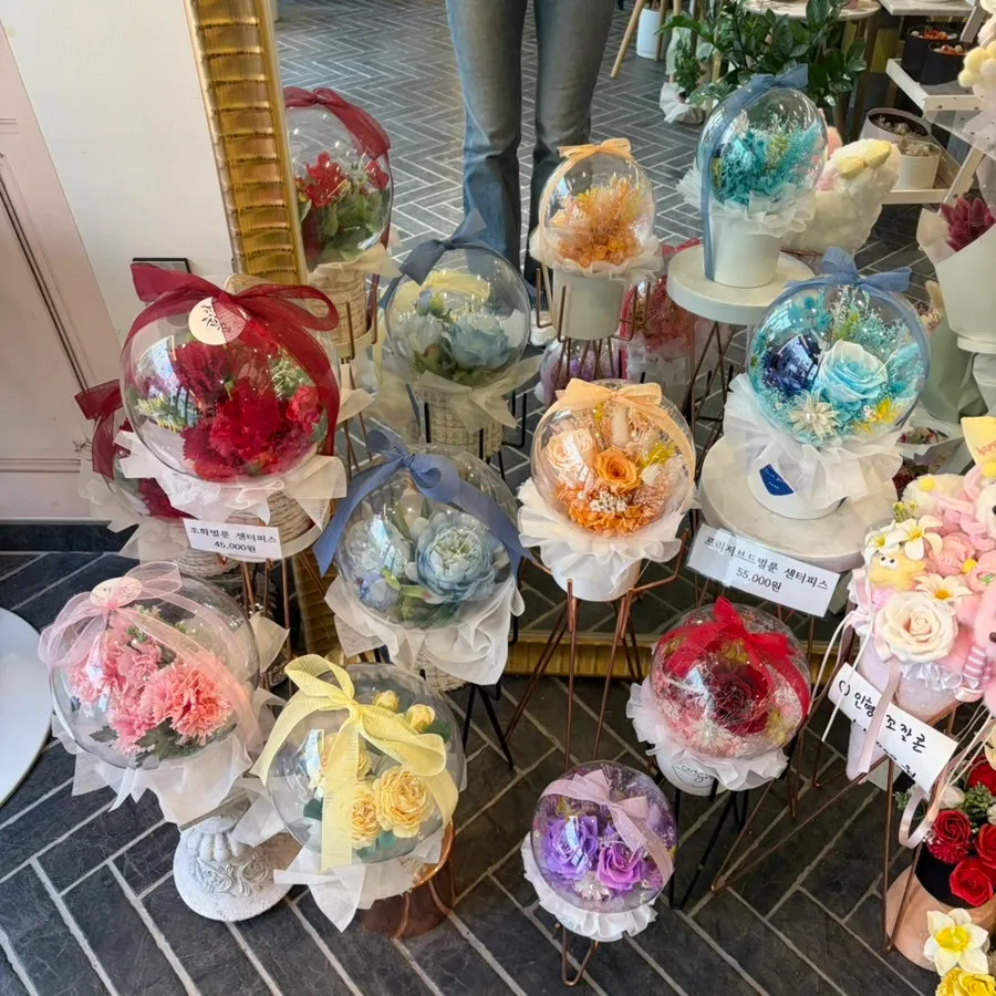Various flowers and plants displayed inside the shop