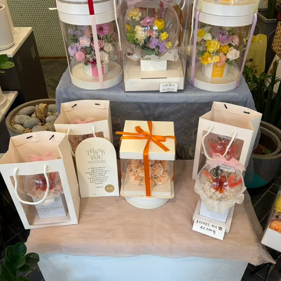 Flower gift shaped like a money box