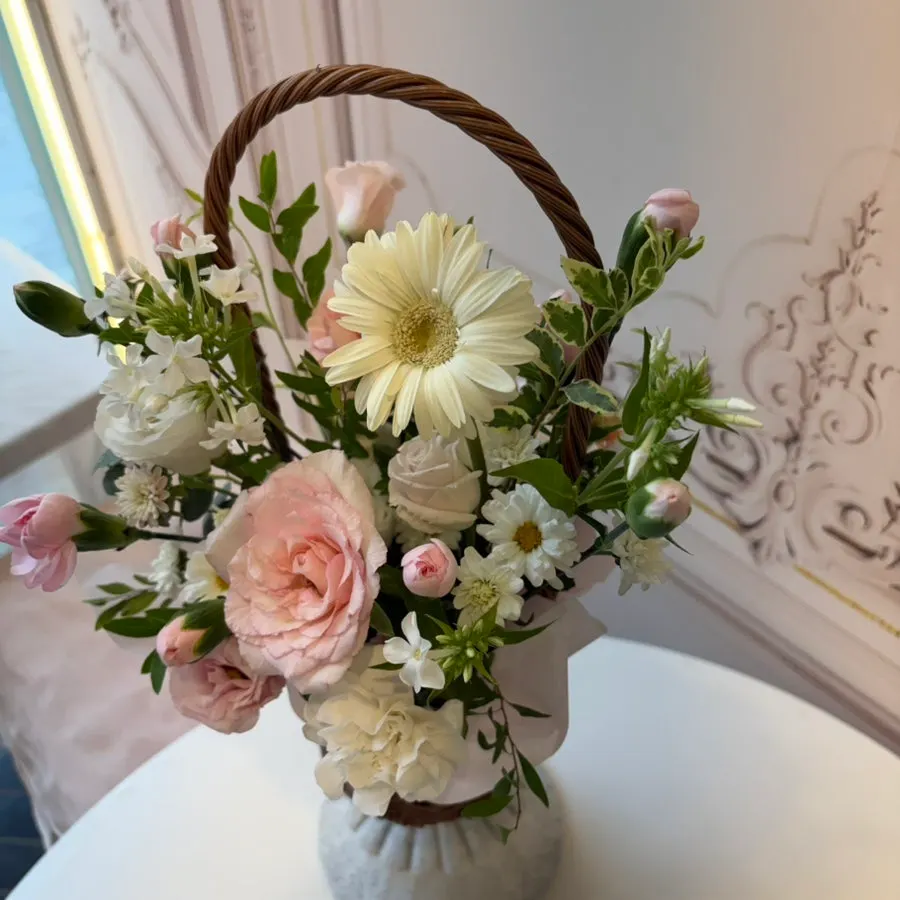 Close-up of the flower combination in the pink basket