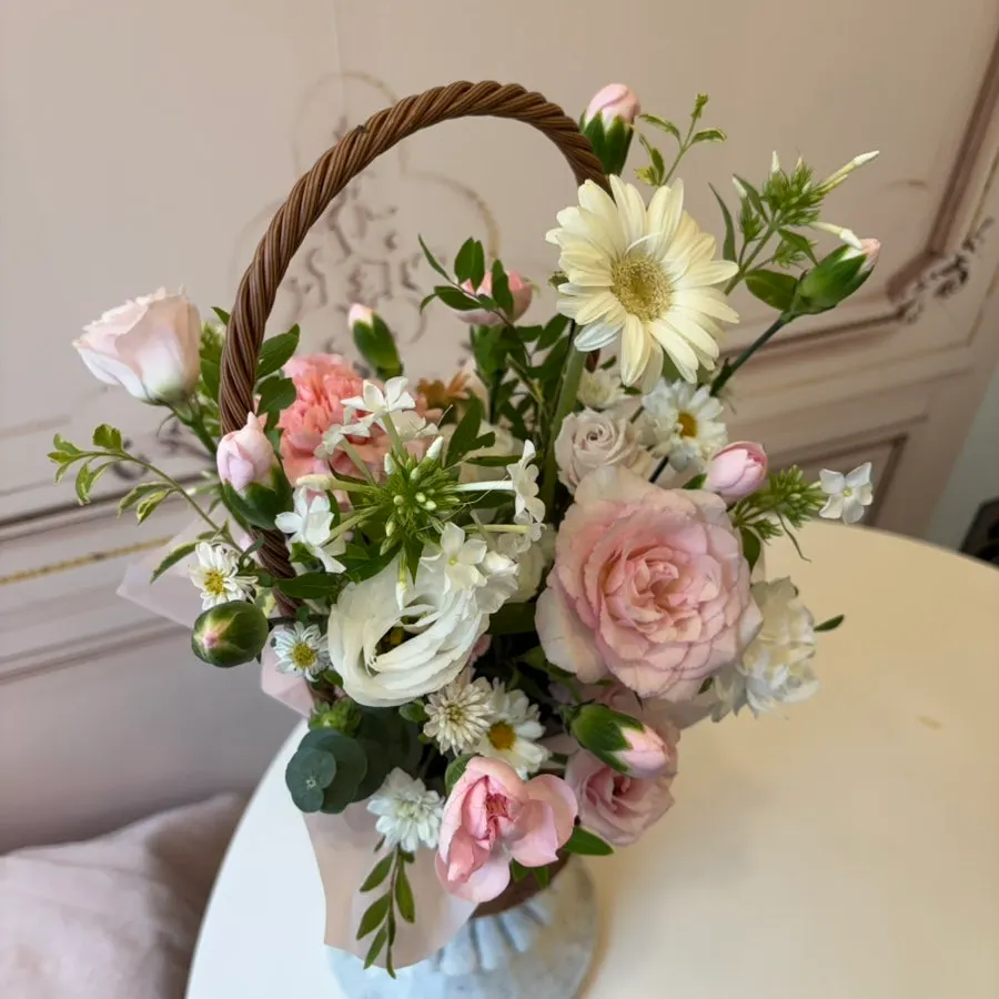 The mini flower basket filled with fresh flowers