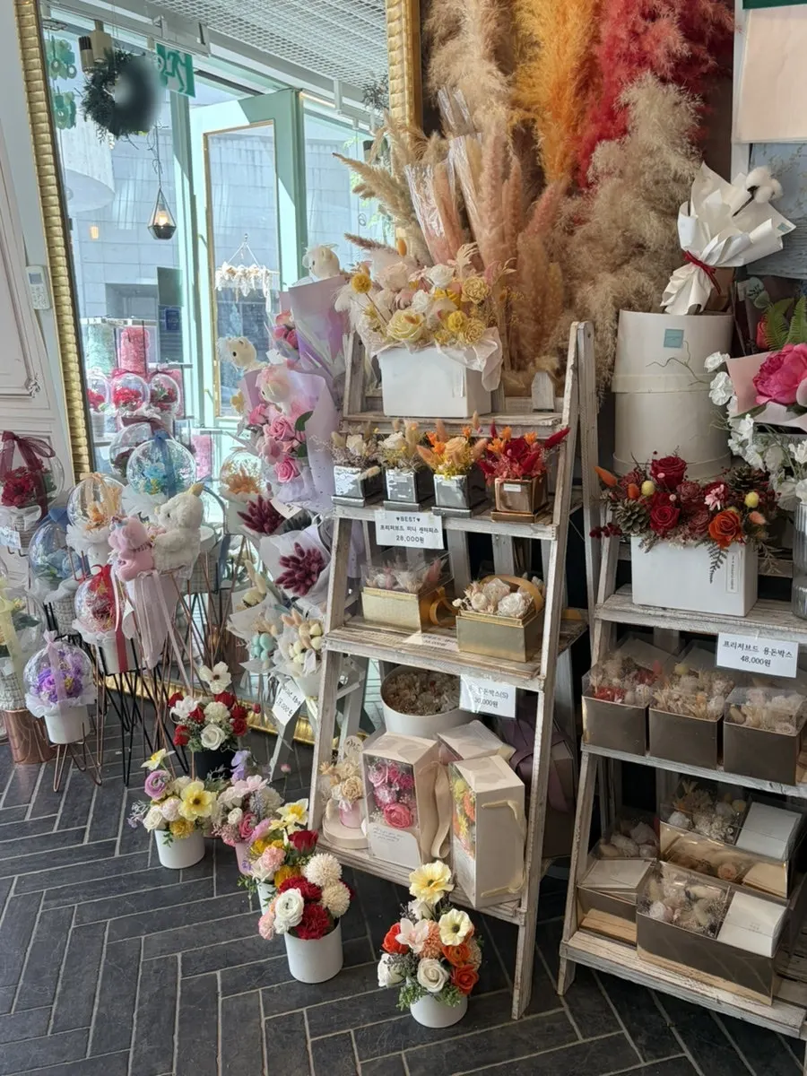 Display shelf with pastel-toned bouquets