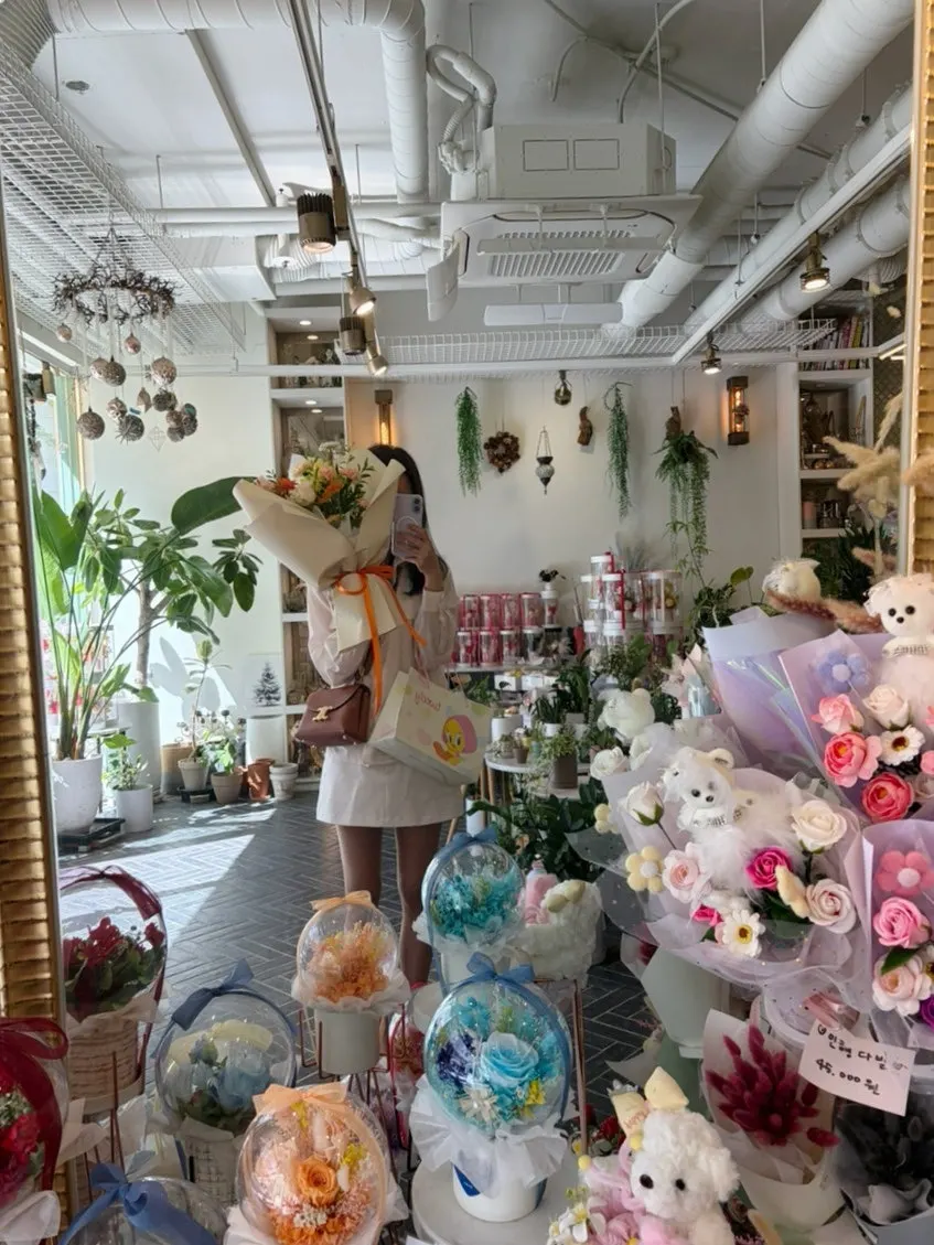 The orange bouquet set casually in a space