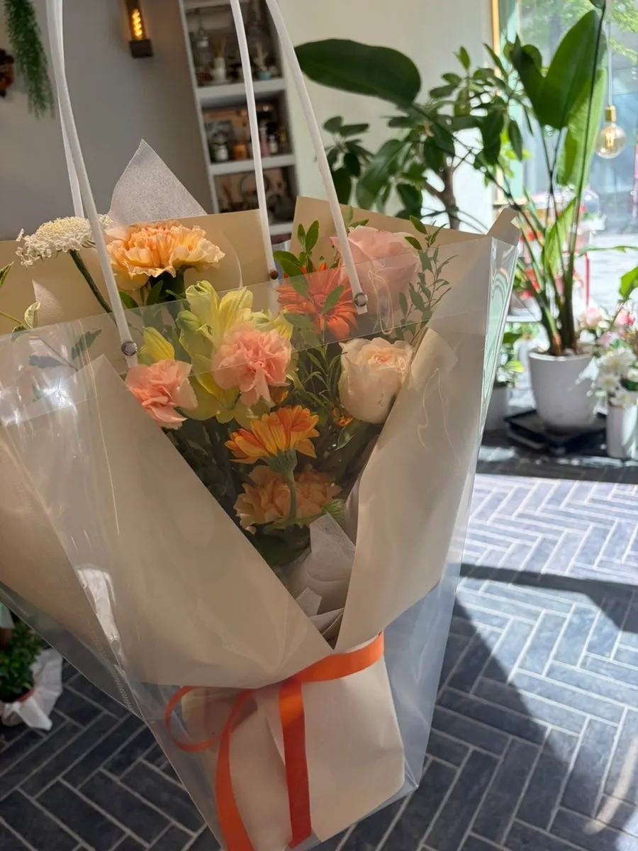 Bouquet wrapped in a clear bag