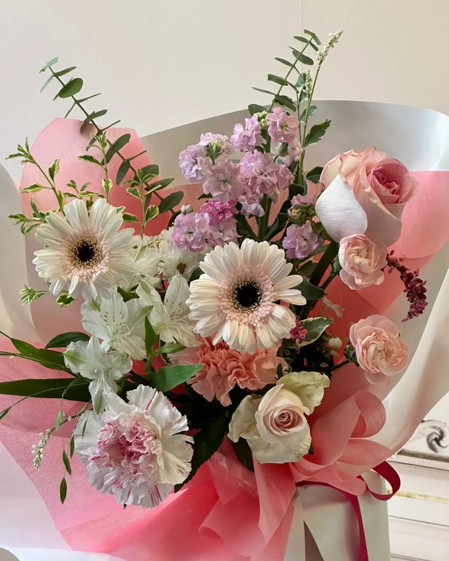 Commemorative photo holding the 6th-anniversary bouquet