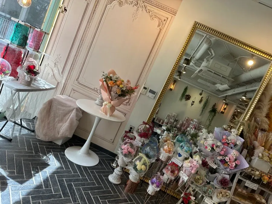 Various flower-related gift products on display
